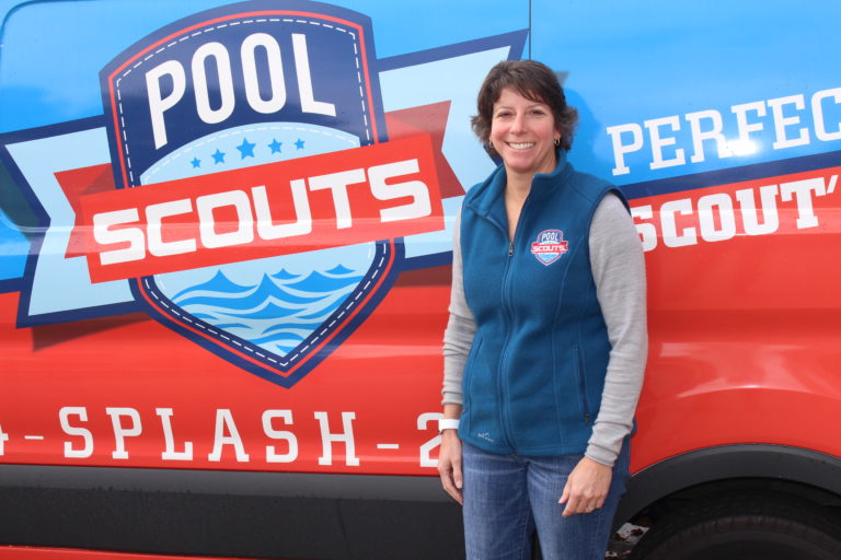 Pool Scouts owner Tiffiny Consoli standing in front of a Pool Scouts van and smiling