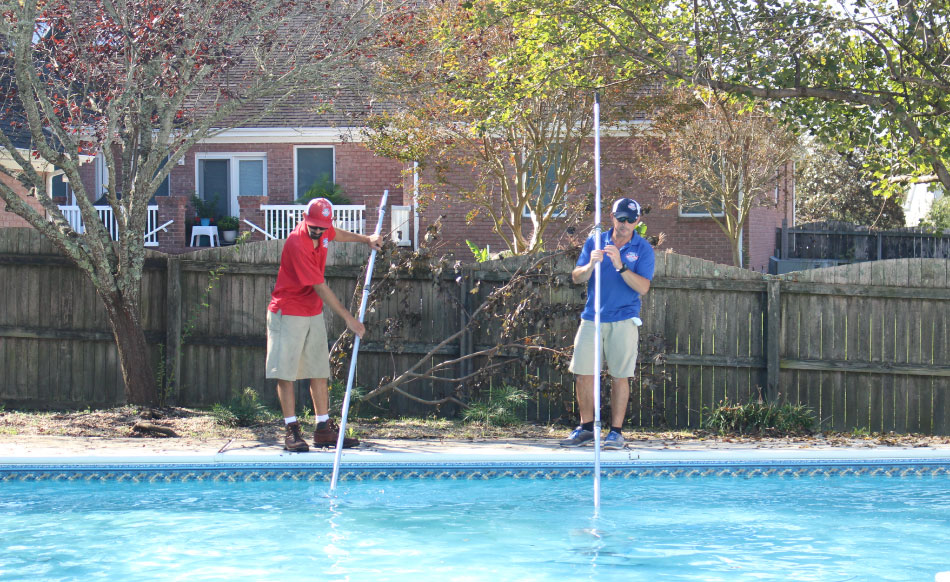 Skilled technicians cleaning pools for Pool Scouts.