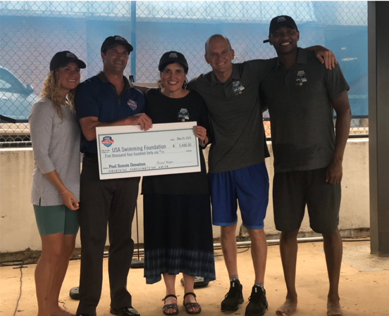Pool Scouts donating a check to the USA Swimming Foundation