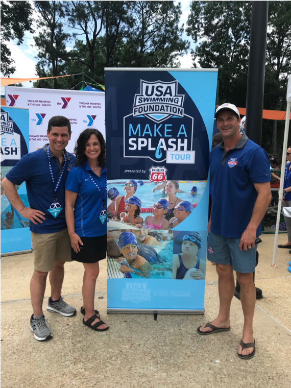 Pool Scouts owners standing with Make A Splash sign at event