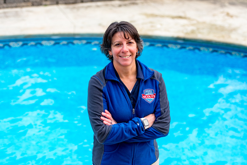 Franchise owner Tiffiny in front of a swimming pool